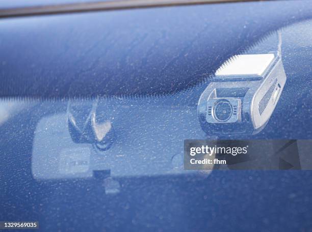 dashcam behind dirty front window of a car - dash cam stock pictures, royalty-free photos & images