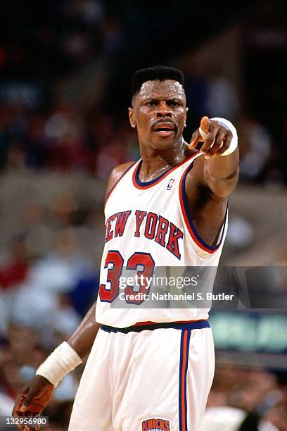 Patrick Ewing of the New York Knicks points during a game at Madison Square Garden circa 1991 in New York. NOTE TO USER: User expressly acknowledges...