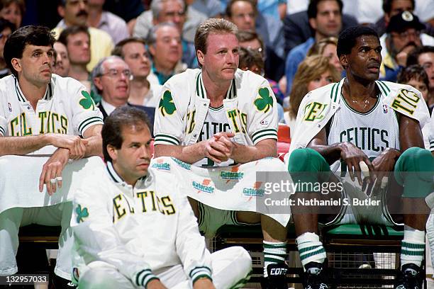 Kevin McHale, Larry Bird and Robert Parish of the Boston Celtics sit on the bench circa 1991 at the Boston Garden in Boston, Massachusetts. NOTE TO...