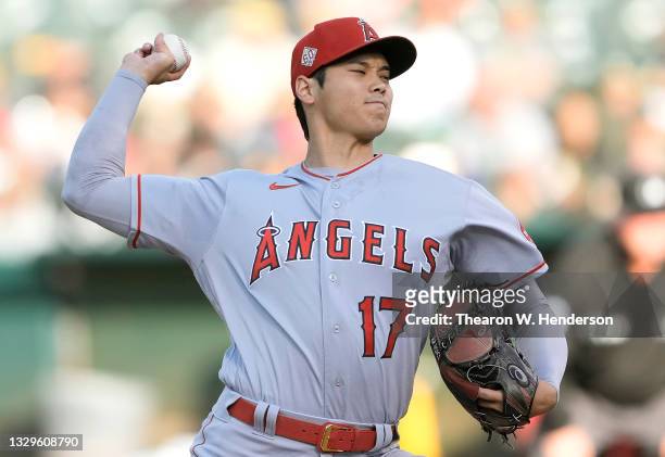 Shohei Ohtani of the Los Angeles Angels pitches against the Oakland Athletics in the bottom of the first inning at RingCentral Coliseum on July 19,...