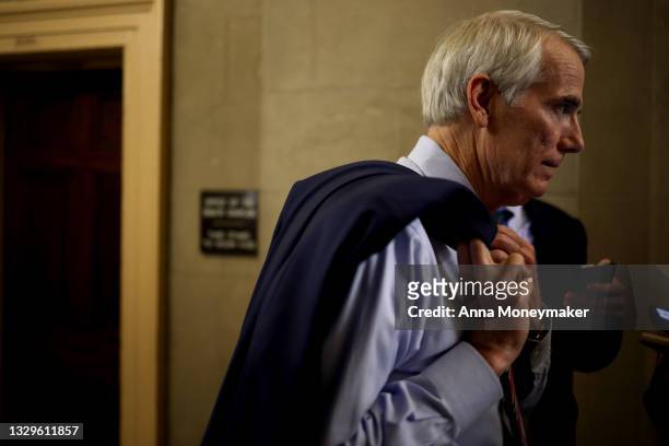 Sen. Rob Portman speaks to reporters as he walks in to the office of Senate Minority Leader Sen. Mitch McConnell on July 19, 2021 in Washington, DC....