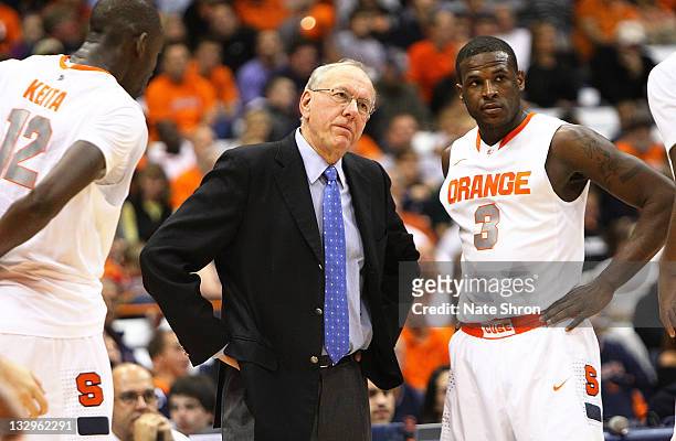 Head coach of the Syracuse Orange, Jim Boeheim looks on from the sideline before a timeout with Dion Waiters during the game against the Albany Great...