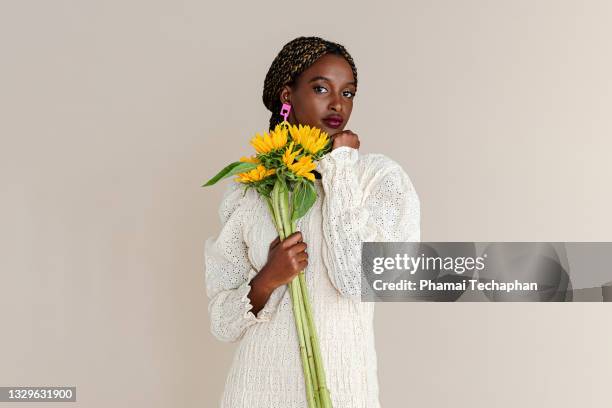 beautiful woman holding sunflowers - beige dress stock pictures, royalty-free photos & images