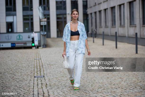 Jacqueline Zelwis is seen wearing Levi’s button shirt, white Josefine HJ x Na-kd Jeans, black Zara cropped top, JW Pei bag in creme white, Havannas...