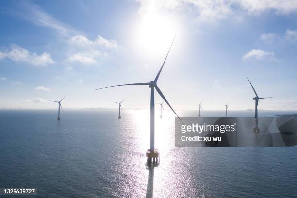 offshore wind power - wind mill stockfoto's en -beelden