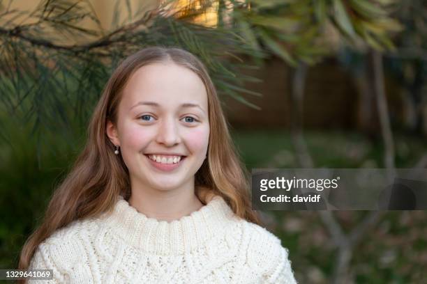 portrait of a happy teenage girl - 14 year old blonde girl stock pictures, royalty-free photos & images