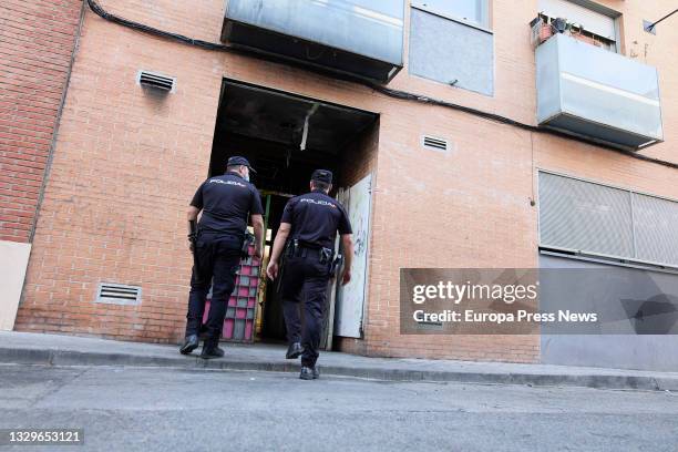 Agents of the National Police enter a building on Jose Garrido Street that was squatted, on 20 July, 2021 in Madrid, Spain. Agents of the National...