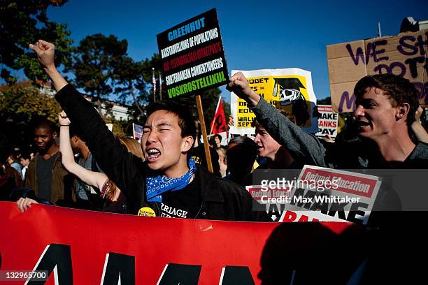 University of California, Berkeley student Daniel Chesmore leads a march through Berkeley as part of an "open university" strike in solidarity with...