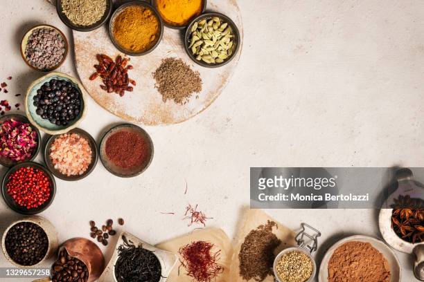many types of colourful spices on white background - spice fotografías e imágenes de stock