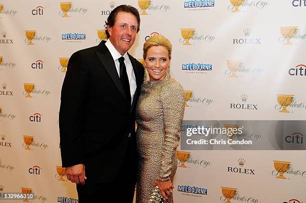 Phil Mickelson of the U.S. Team and his wife Amy Mickelson arrive on the red carpet at the Gala Celebration for the 2011 Presidents Cup at the Crown...