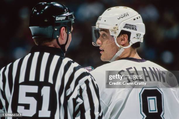 Teemu Selanne, Right Wing for the Mighty Ducks of Anaheim talks to Linesman Baron Parker during the NHL Western Conference Pacific Division game...