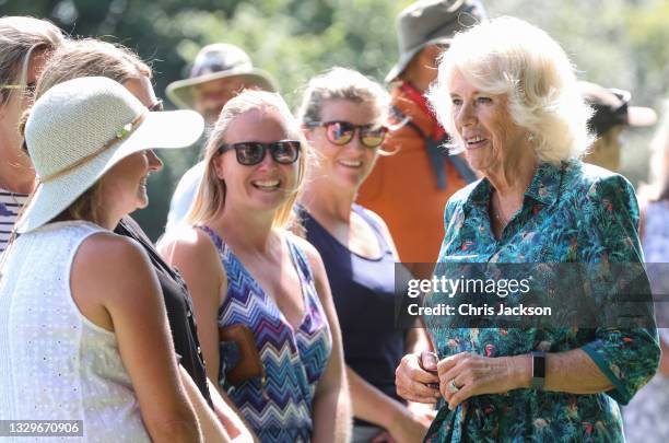 Camilla, Duchess of Cornwall speaks with well-wishers as she visits Five Islands Academy School for an Eco Conference, with Prince Charles, Prince of...