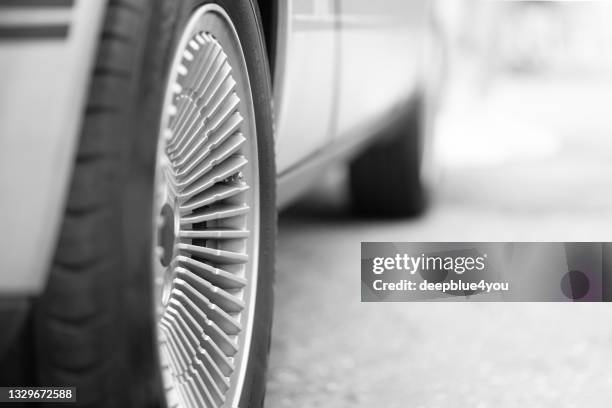 parked car with focus on the right rim and rear wheel - wheel rim stock pictures, royalty-free photos & images