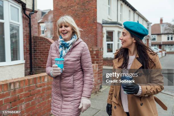 mother and daughter catch up - uk street stock pictures, royalty-free photos & images