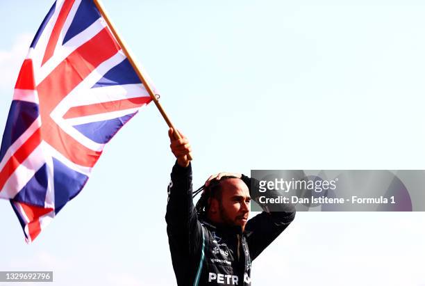 Race winner Lewis Hamilton of Great Britain and Mercedes GP celebrates in parc ferme during the F1 Grand Prix of Great Britain at Silverstone on July...
