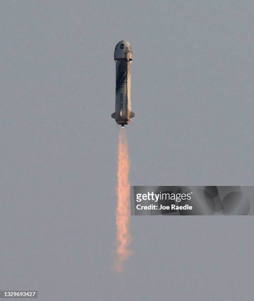 Blue Origin’s New Shepard flies into space from the launch pad carrying Jeff Bezos along with his brother Mark Bezos, 18-year-old Oliver Daemen, and...