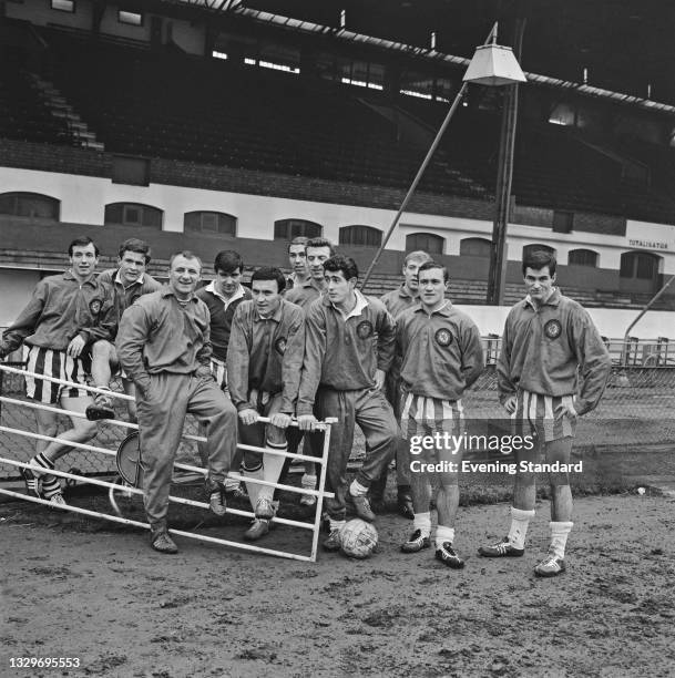 Tommy Docherty , manager of Chelsea FC, with members of the team, UK, 20th February 1965. They will be playing Tottenham Hotspur in an FA Cup 5th...