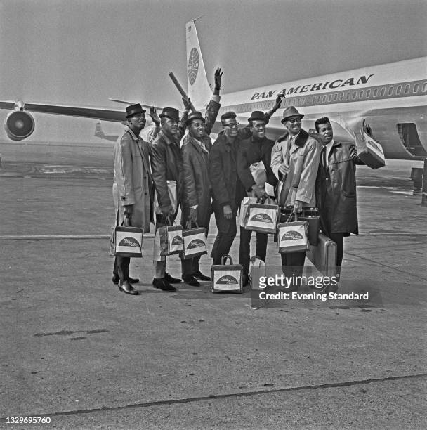 American vocal group The Temptations arrive at London Airport to take part in the Tamla-Motown Revue tour of the UK, UK, 15th March 1965.