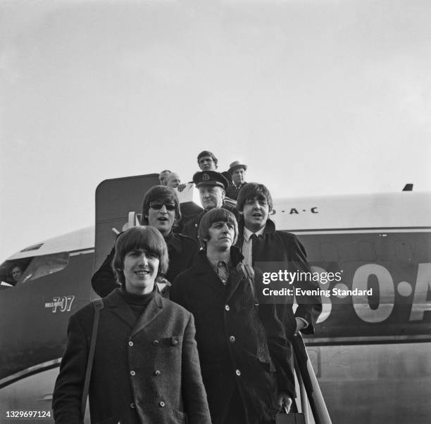 English rock group the Beatles arrive back at London Airport , UK, 11th March 1965. They are returning from the Bahamas after filming scenes for the...