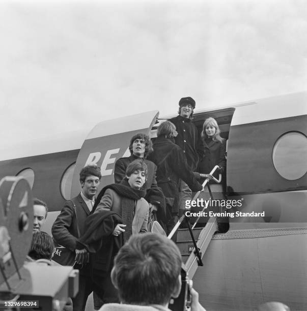 English pop group the Beatles leave London Airport for Salzburg in Austria, to resume filming of the movie 'Help!', UK, 13th March 1965. They are...