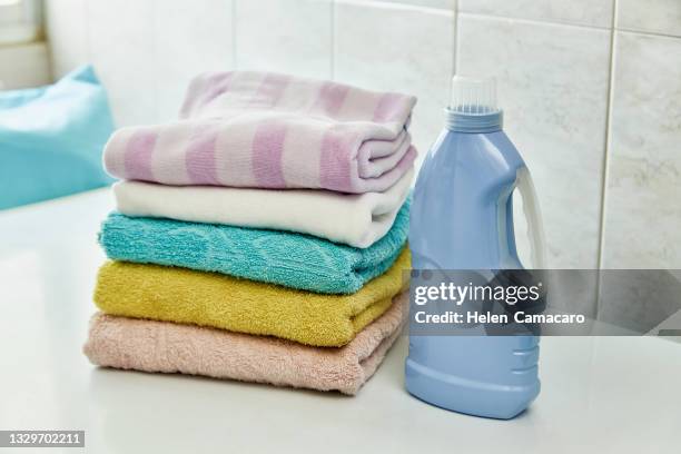 stack of soft and colorful towels on table with copy space - folded towel stock-fotos und bilder