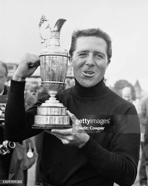 Gary Player of South Africa holds the Claret Jug Champion Golfer Trophy after winning the 97th Open Championship golf tournament on 13th July 1968 at...