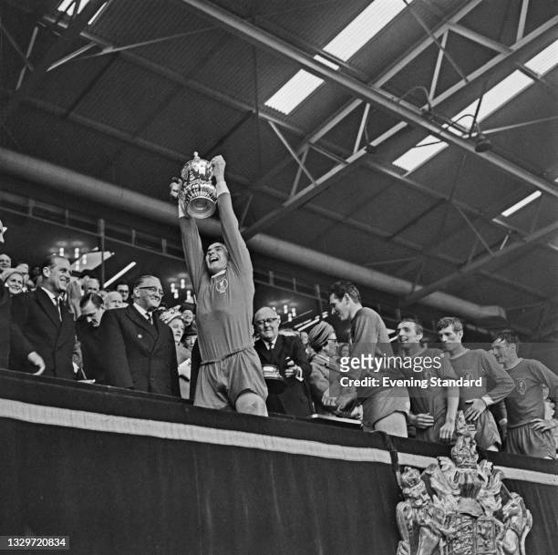 Ron Yeats, captain of Liverpool FC, is followed by his teammates after winning the 1965 FA Cup final at Wembley Stadium in London, UK, 1st May 1965....