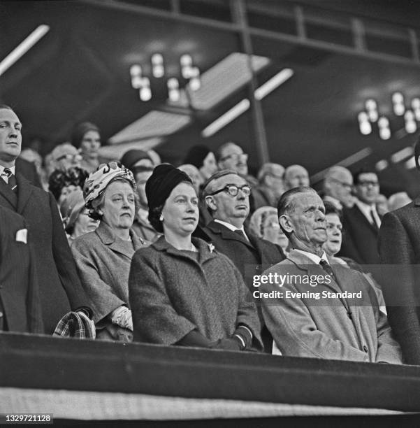 Queen Elizabeth II watches the 1965 FA Cup final at Wembley Stadium in London, UK, 1st May 1965. Liverpool beat Leeds United 2-1. Behind and to the...