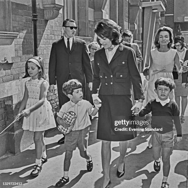 Jacqueline Kennedy , the widow of former US President John F. Kennedy, with her son John F. Kennedy Jr. , daughter Caroline Kennedy, sister Lee...