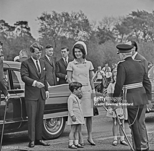 Jacqueline Kennedy , the widow of former US President John F. Kennedy, with her brother-in-law Robert F. Kennedy , her son John F. Kennedy Jr. And...