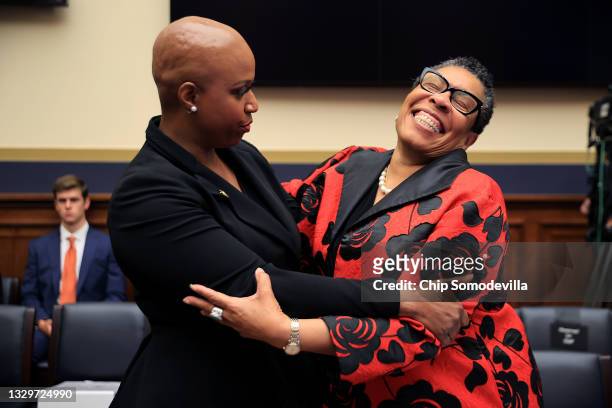 House Financial Services Committee member Rep. Ayanna Pressley embraces Housing and Urban Development Secretary Marcia Fudge before she testifies to...