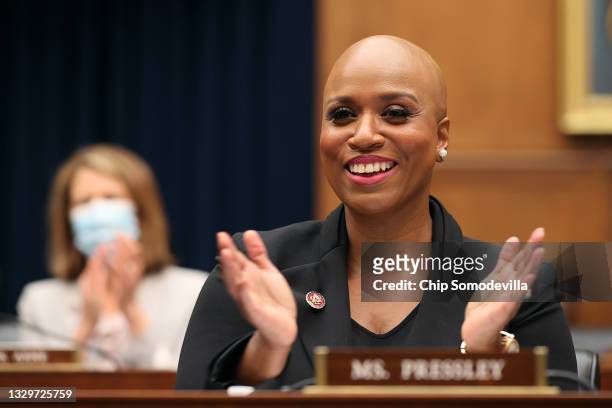 House Financial Services Committee member Rep. Ayanna Pressley applauds as Housing and Urban Development Secretary Marcia Fudge is introduced during...