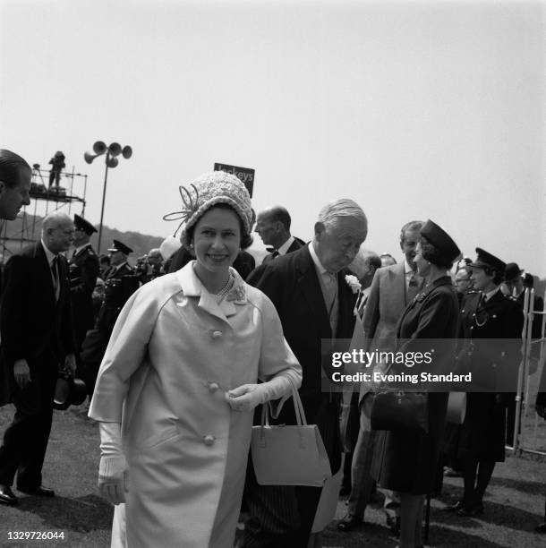 Queen Elizabeth II with Bernard Fitzalan-Howard, 16th Duke of Norfolk at the Epsom Derby, UK, 2nd June 1965.