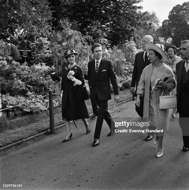 Princess Margaret and her husband Lord Snowdon at the Chelsea Flower Show in London, UK, 27th May 1965. On the left is Anne Parsons, Countess of...