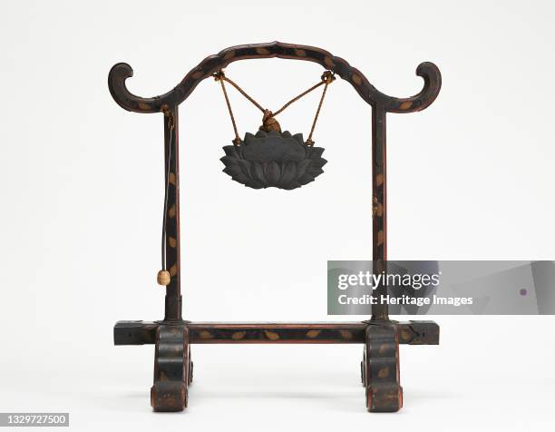 Frame for a gong with a bronze gong suspended by a cord; mallet hanging, Edo period, 1615-1868. Artist Unknown.