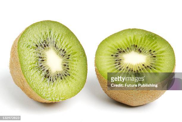 Kiwi fruit sliced into halves. Studio shoot on April 22 United Kingdom.