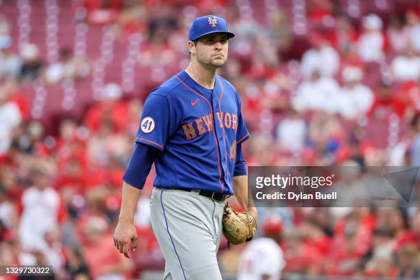Jerad Eickhoff of the New York Mets walks across the field in the first inning against the Cincinnati Reds at Great American Ball Park on July 19,...