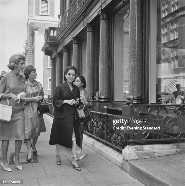 Japanese businesswoman Dewi Sukarno, the wife of Sukarno, President of Indonesia, in London, UK, 26th June 1965. She is attending the wedding party...