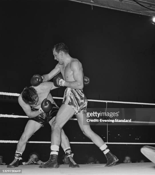 British heavyweight boxer Henry Cooper takes on Johnny Prescott to retain the British and Commonwealth heavyweight titles at St Andrew's Stadium in...