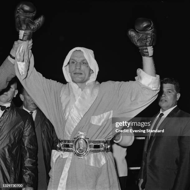 British heavyweight boxer Henry Cooper after beating Johnny Prescott to retain the British and Commonwealth heavyweight titles at St Andrew's Stadium...