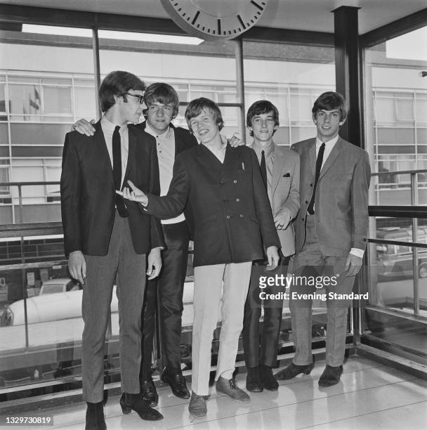 English pop group Herman's Hermits at London Airport , UK, 22nd June 1965. From left to right, they are guitarist Derek Leckenby, bass player Karl...