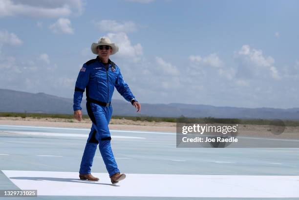 Jeff Bezos walks near Blue Origin’s New Shepard after flying into space on July 20, 2021 in Van Horn, Texas. Mr. Bezos and the crew that flew with...