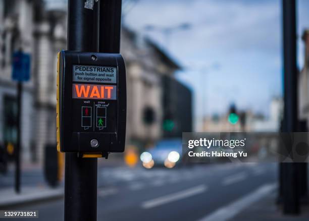 pedestrain signal button in london - pedestrian crossing light stock pictures, royalty-free photos & images