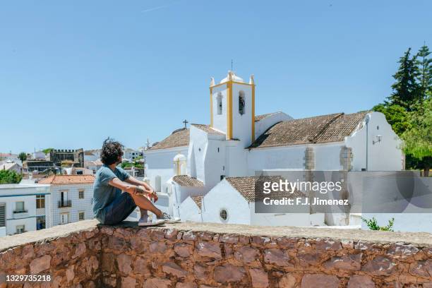 man in tavira, algarve village, portugal - distrito de faro portugal imagens e fotografias de stock