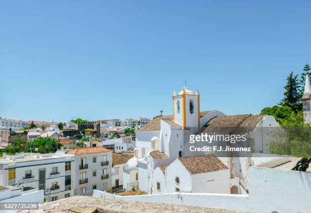 landscape of the village of tavira with church - faro city portugal foto e immagini stock
