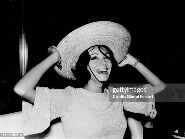 Italian actress Maria Grazia Buccella upon arrival at Madrid airport to shoot "Villa ride", Spain, 1963.