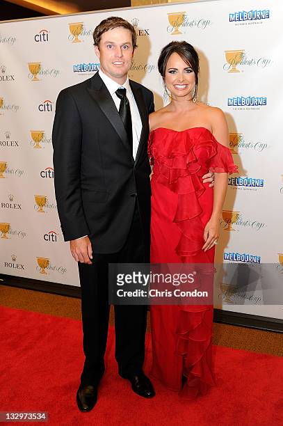 Nick Watney of the U.S. Team and his wife Amber Watney arrive on the red carpet at the Gala Celebration for the 2011 Presidents Cup at the Crown...