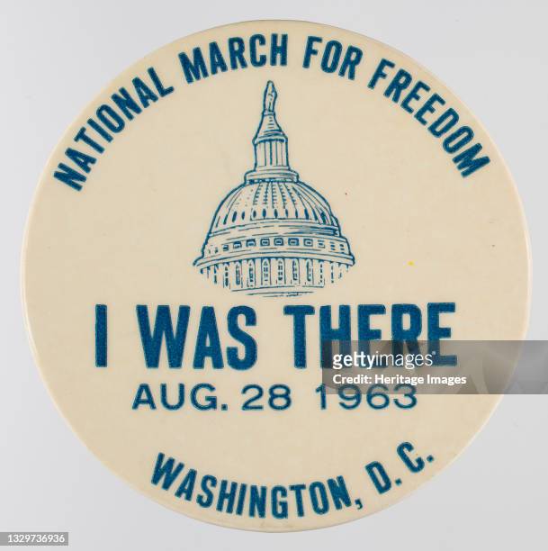 Close-up of a white pin from the March on Washington for Jobs and Freedom. The purpose of the 1963 March on Washington for Jobs and Freedom was to...
