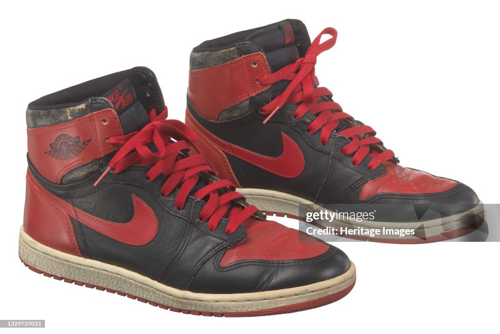 Pair Of Red And Black Air Jordan I High Top Sneakers Made By Nike