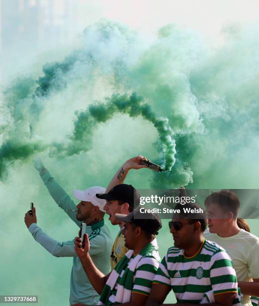 Celtic fans light smoke flares ahead of the UEFA Champions League Second Qualifying Round First Leg between Celtic and FC Midtjylland at Celtic Park...